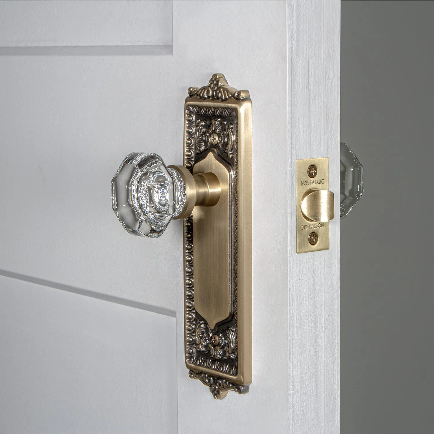 Egg & Dart Long Plate with Waldorf Knob in Antique Brass